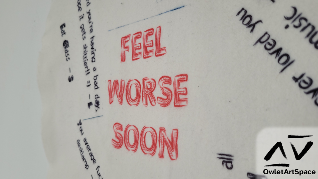 The "Feel Worse Soon" piece at a 45 degree angle zoomed into the text "Feel Worse Soon"