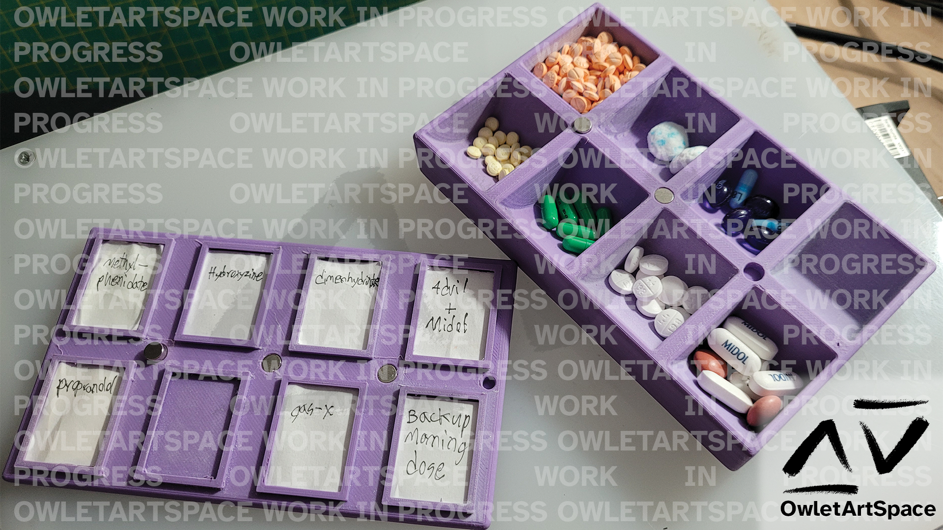 A purple box with cutouts for eight different medicines or mixtures of medicines. Currently a work in progress.