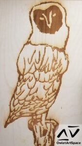 A wooden laser engraved lineart of the Owl Mural.