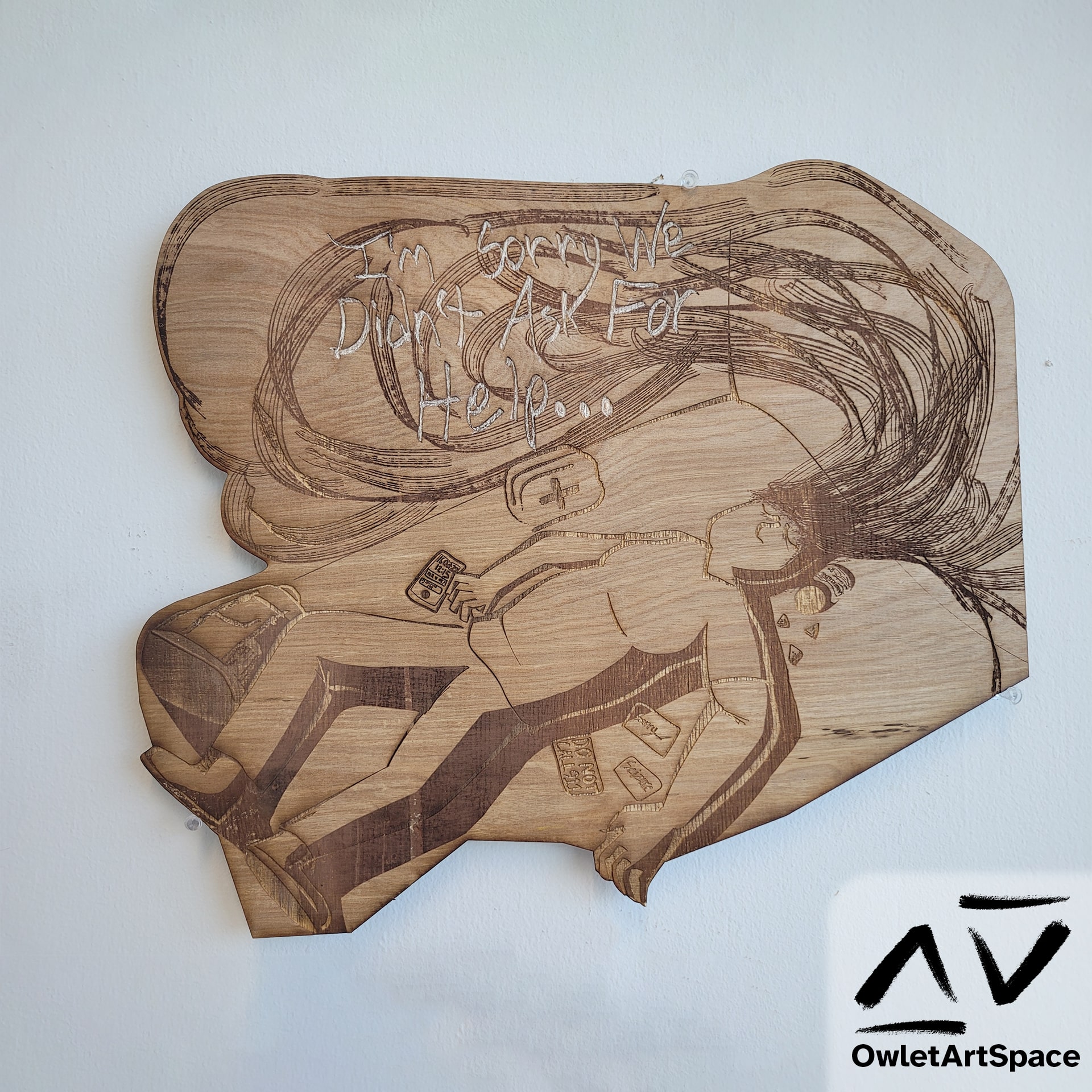 The "I'm sorry we didn't ask for help" artwork but as a laser engraging onto plywood.